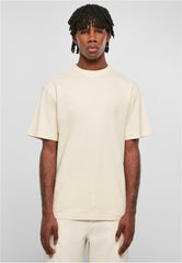 Urban classics tall tee for men in beige color worn by male model with short sleeves and relaxed fit