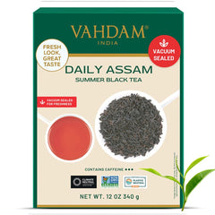 VAHDAM Daily Assam summer black tea box showing loose Assam black tea leaves in spoon and brewed cup