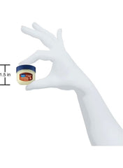 Vaseline cocoa butter lip therapy in small jar held by a white gloved hand