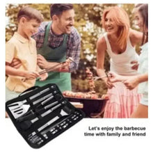 BBQ tool kit with stainless utensils open beside a family grilling on an outdoor BBQ