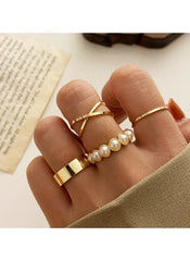 4-piece gold ring set online featuring minimalist gold bands and pearl accents on fingers