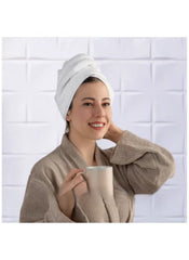Woman in bathrobe with white towel wrapped on head, promoting 8 piece towel set online by Huitich