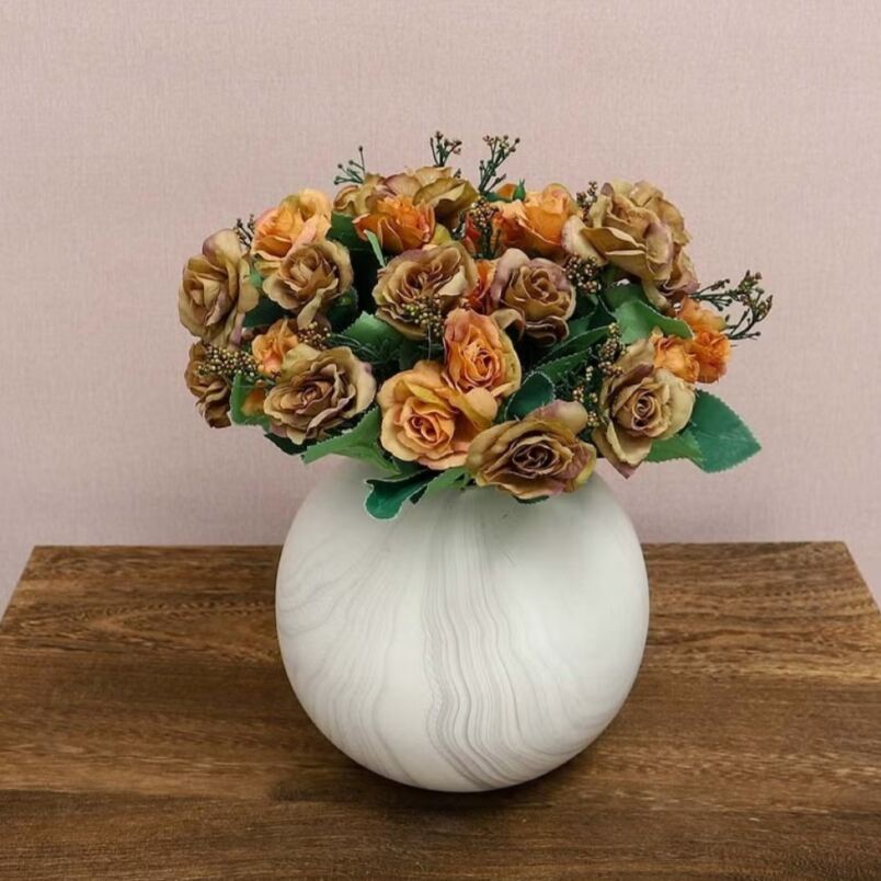 Huitich artificial orange rose bouquet arranged in a round white vase on wooden surface