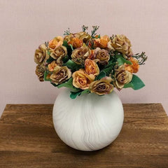 Huitich artificial orange rose bouquet arranged in a round white vase on wooden surface