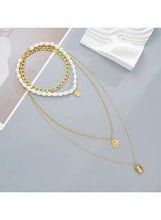 Gold-tone faux pearl and chunky chain necklace set with round coin charms and rectangle charm