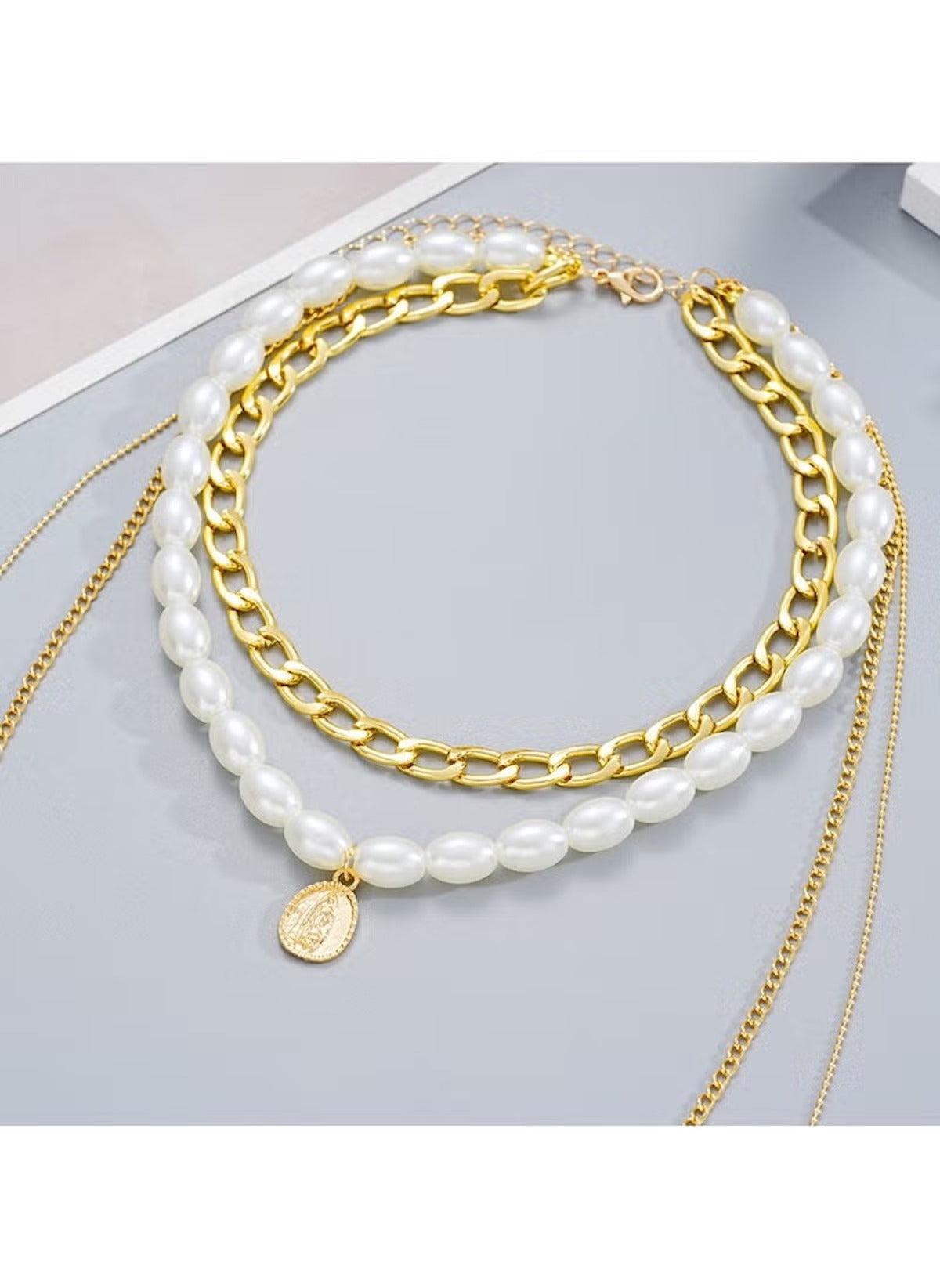 Huitich chunky chain and faux pearl necklace with gold links and white pearls featuring a gold charm pendant