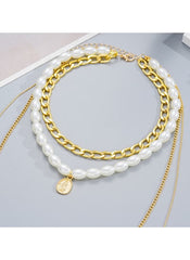 Huitich chunky chain and faux pearl necklace with gold links and white pearls featuring a gold charm pendant