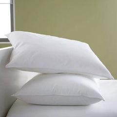 Huitich white cotton bed pillows UAE stacked on bed with clean smooth fabric