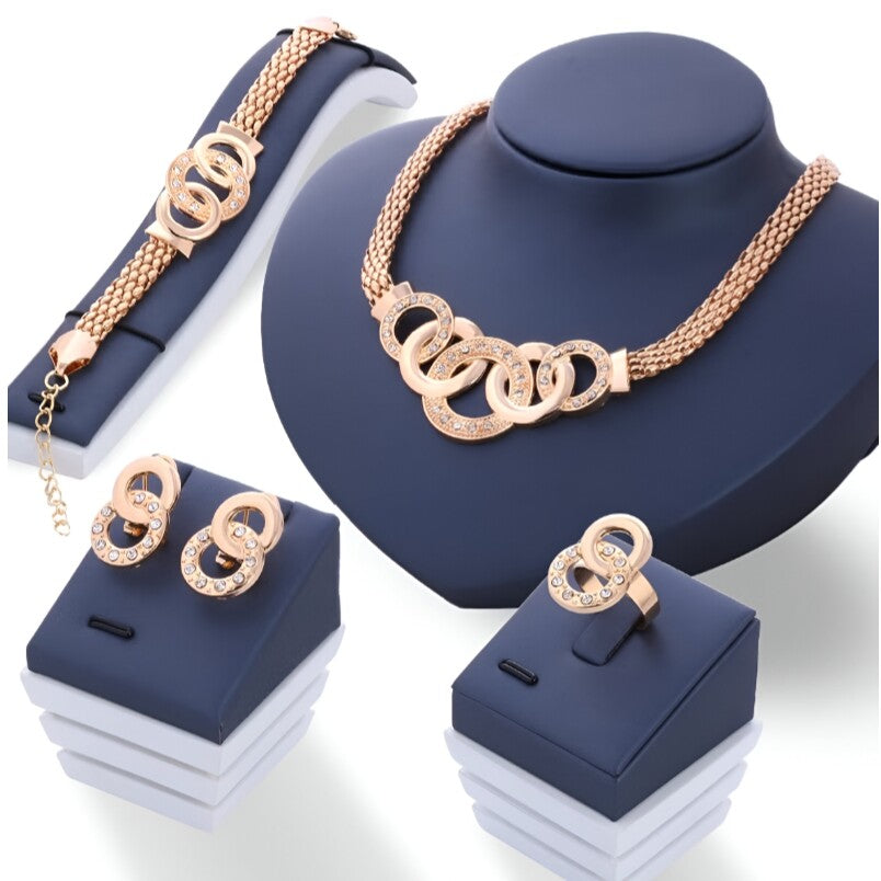 Huitich four piece gold jewelry set including pendant necklace, bracelet, earrings, and ring with circular design