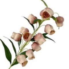 Huitich artificial flowers with pink buds and green leaves placed in a gold and green chopstick holder