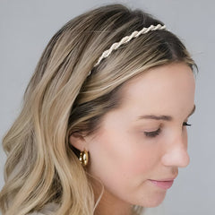 Huitich gold pearl headband for girls worn by woman with blonde hair and gold hoop earrings