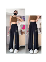 Black wide-leg office pants with elastic waist and full-length wide legs