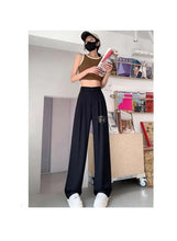 Black wide-leg office pants with gathered waistband and wide flared legs