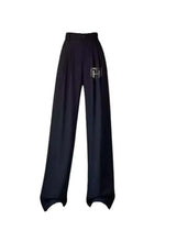 Black wide-leg office pants with pleated front and elastic waistband