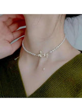 Pearl choker necklace with gold butterfly crystal pendant and pearl drop