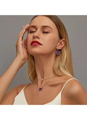 Huitich purple butterfly jewelry set featuring earrings and necklace worn by woman
