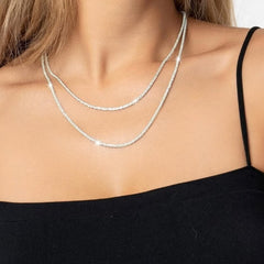 Huitich silver layered choker necklace with two sparkling silver chains worn on a woman's neck
