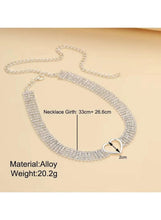 Silver rhinestone heart choker necklace, flat lay with open heart clasp and links.