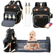 Black changing backpack with portable mat and side pockets, tan leather-look hardware
