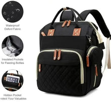 Black baby changing backpack with side insulated bottle pocket and tan leather-look accents