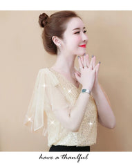 Elegant women's sequin chiffon blouse in soft yellow with sheer sleeves for a stylish look