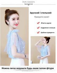 Elegant women's sequin chiffon blouse in light blue with stylish flutter sleeves and a comfortable fit