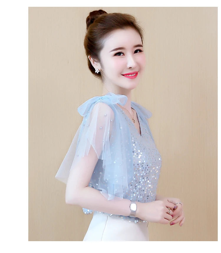 Stylish women's sequin chiffon blouse with flutter sleeves in light blue for a chic look