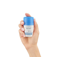 Vichy 48 hour aluminum free deodorant in hand with a blue cap for all-day freshness