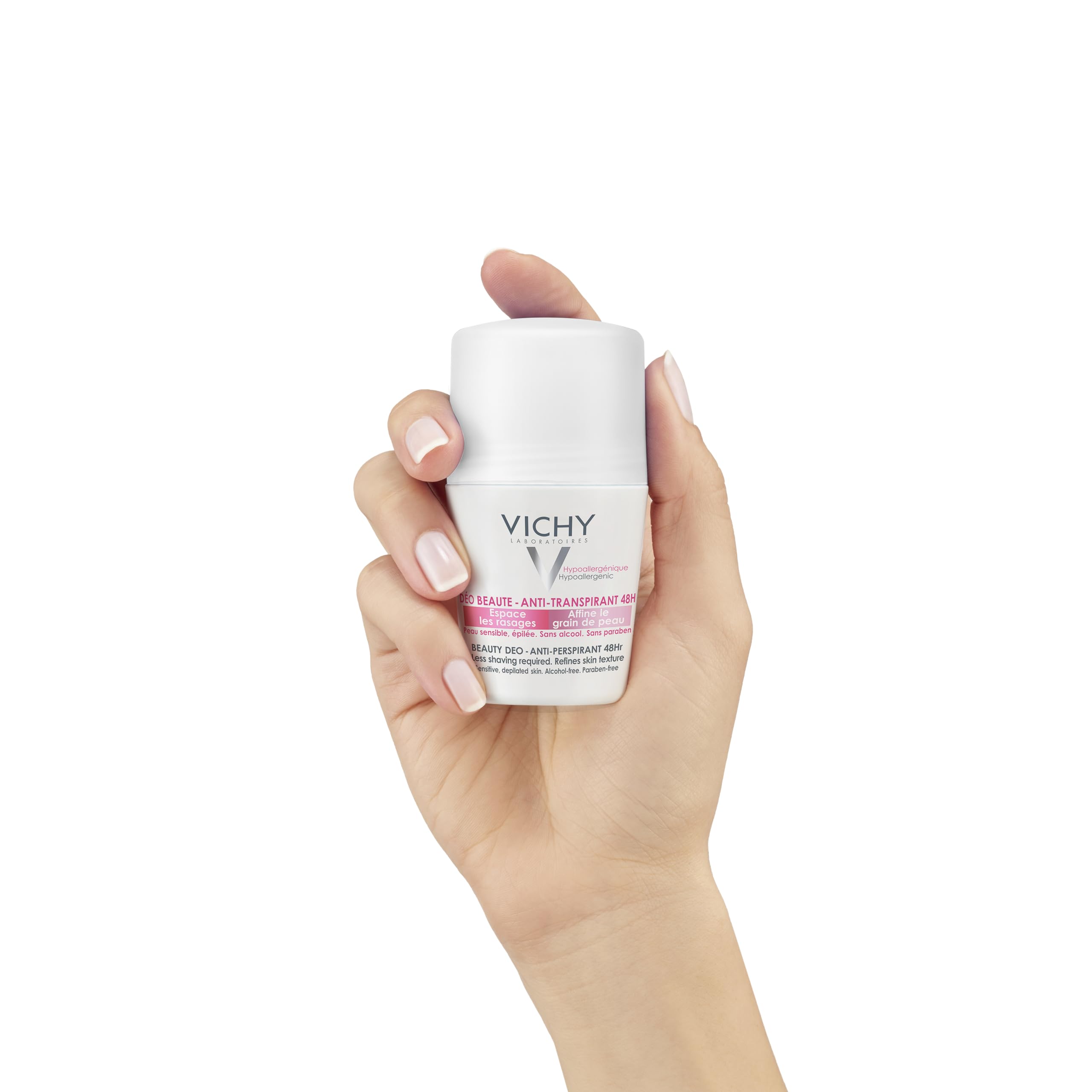 Vichy 48 hour deodorant for women in a roll-on bottle held in a woman's hand
