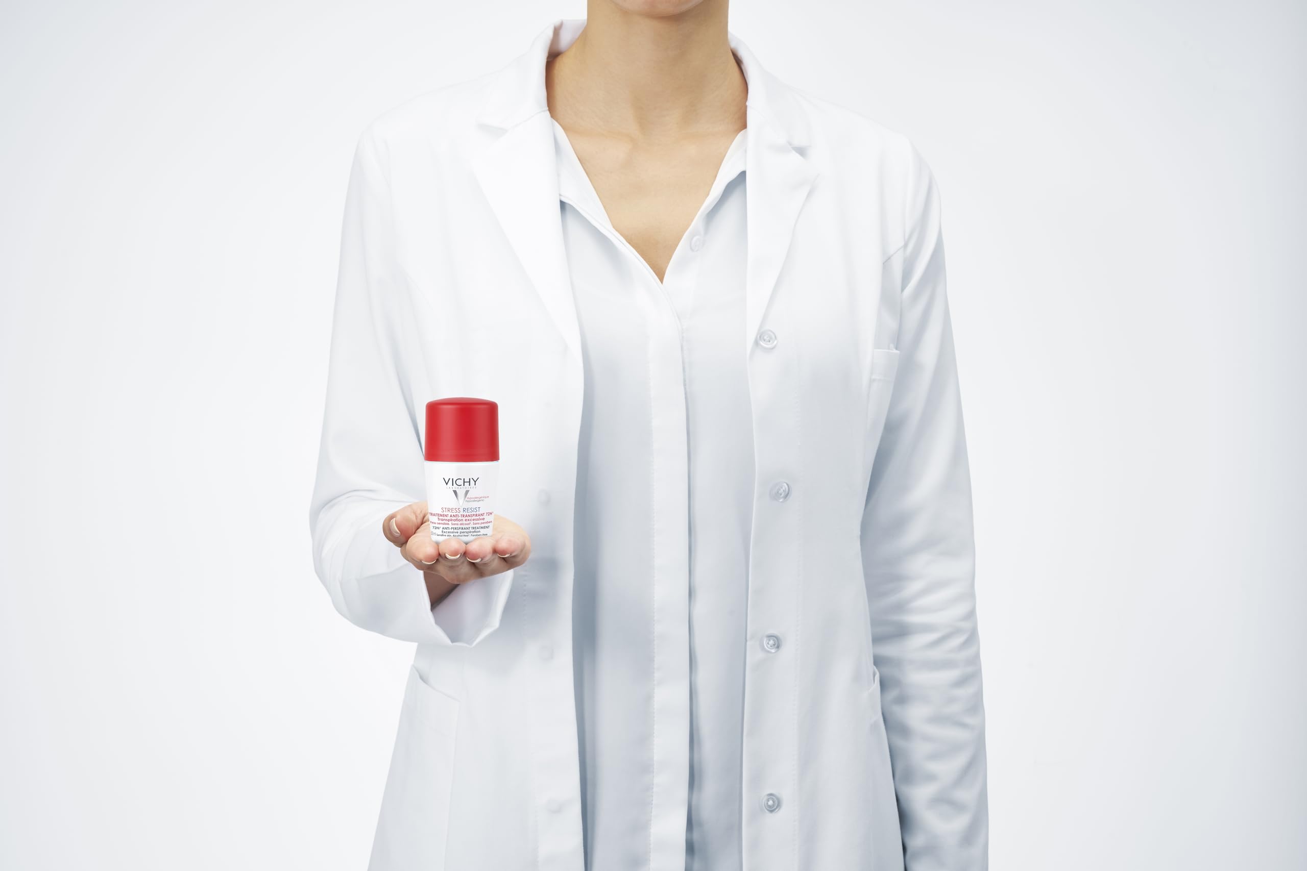 Vichy anti-stress roll-on deodorant held by a lab-coat wearing professional for effective odor protection