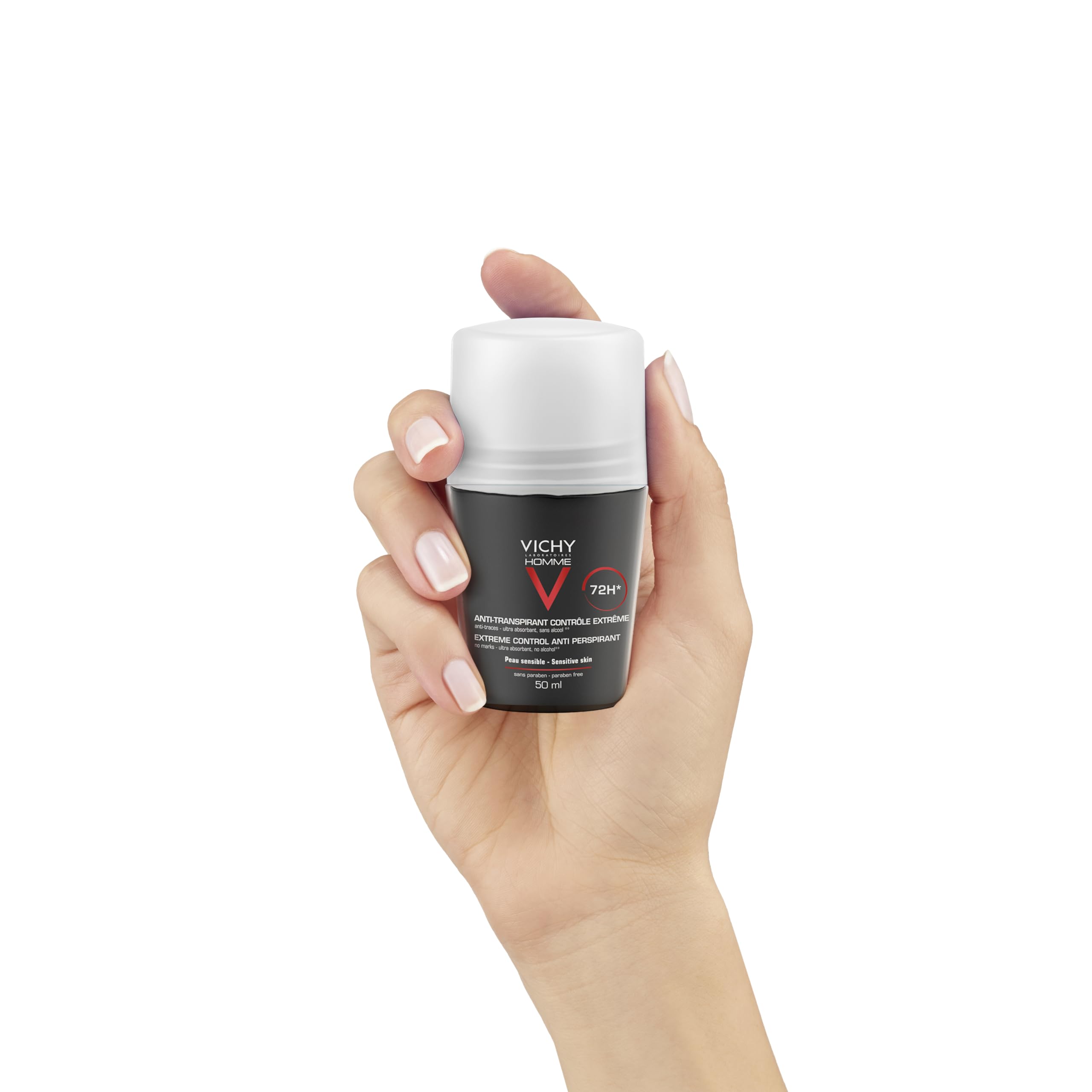 Vichy men's 72-hour antiperspirant in a compact roll-on bottle held in a hand