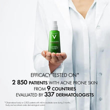 Doctor holding Vichy Normaderm moisturizer bottle with text on tested efficacy