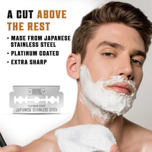 Safety razor and shaving lather on a man’s face, with blade pack