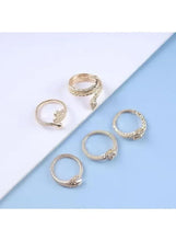 Silver-tone snake rings set, five rings with coiled snake designs