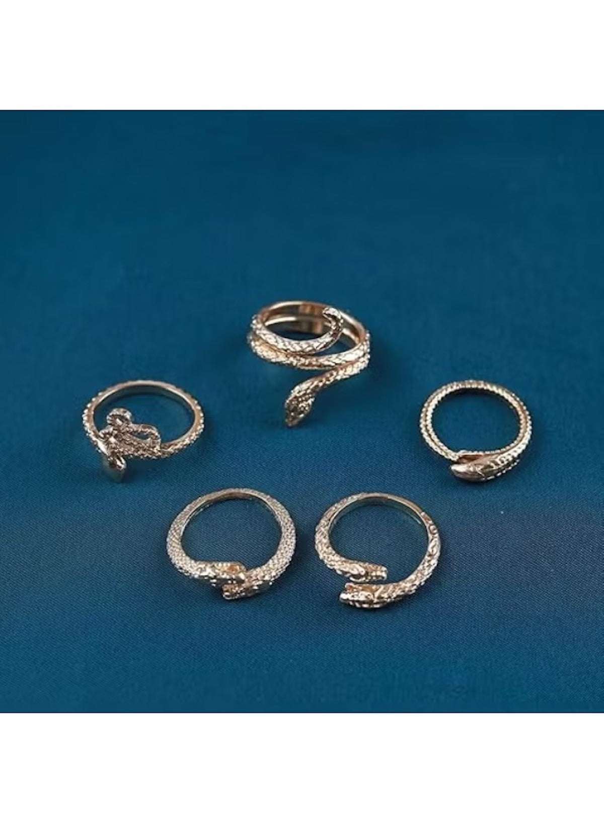 Vintage gold snake ring set featuring intricate snake designs in a unique layered style