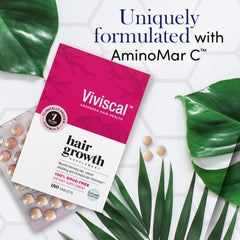 Viviscal hair growth supplement for women box with blister tablets and green leaves highlighting AminoMar C formula