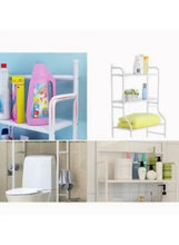 Bathroom storage rack with open shelves and top bar, shown with bathroom items