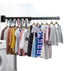 Huitich wall-mounted foldable clothes hanger rack holding multiple colorful clothes in a laundry room