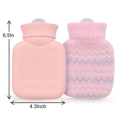 Pink mini hot water bottle with knitted cover showing silicone bottle and removable pink knit sleeve