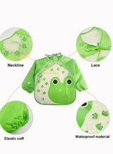 Green baby feeding bib with long sleeves, elastic cuffs, lace neckline, waterproof