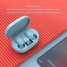 Light blue wireless earbuds with open charging case and LED display