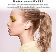 White Bluetooth earbuds in a woman’s ears