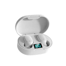 White wireless earbuds in open charging case with blue-green LED display