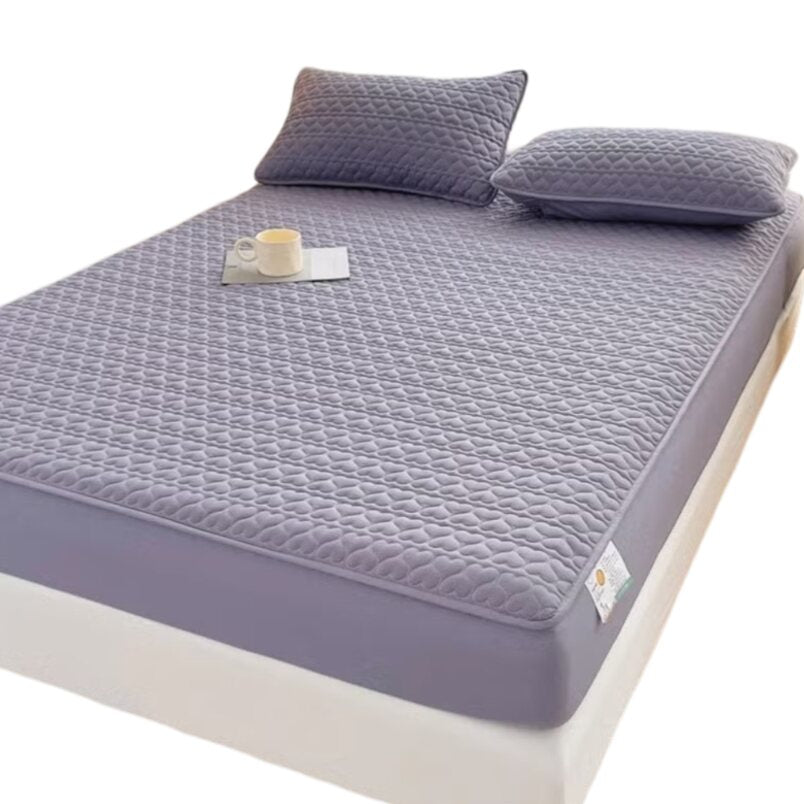Huitich fitted sheets covering a waterproof king size mattress topper with quilted texture and matching pillows