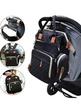 Black maternity backpack with stroller strap hooks and side pockets, quilted front panel