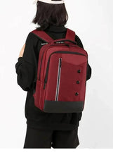 Waterproof travel backpack back view, maroon with adjustable shoulder straps