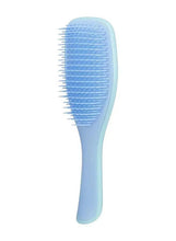 Blue wet detangling hair brush with wide paddle head and flexible bristle teeth