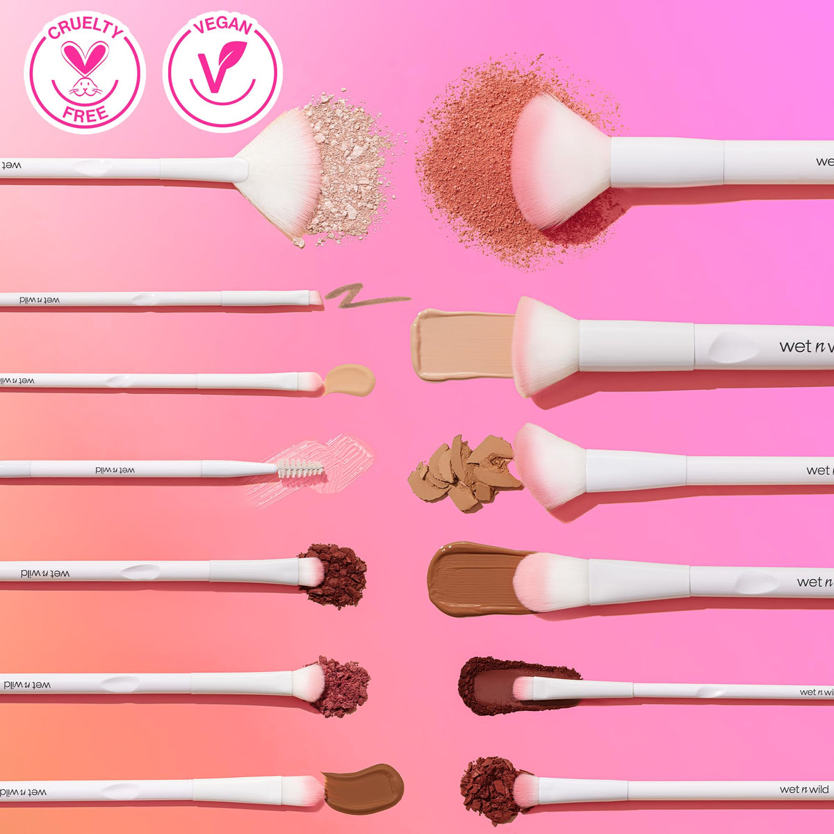Wet n Wild concealer brush for under eyes with white handle displaying various makeup powders and creams on pink background