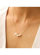 Gold tone pearl cluster pendant necklace with three white pearls on fine chain