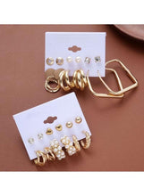 Retro earrings set on cards: mixed gold hoops, pearls, and small crystal studs
